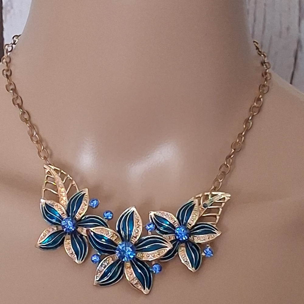 Goldtone Floral Hibiscus Necklace With Blue Accents